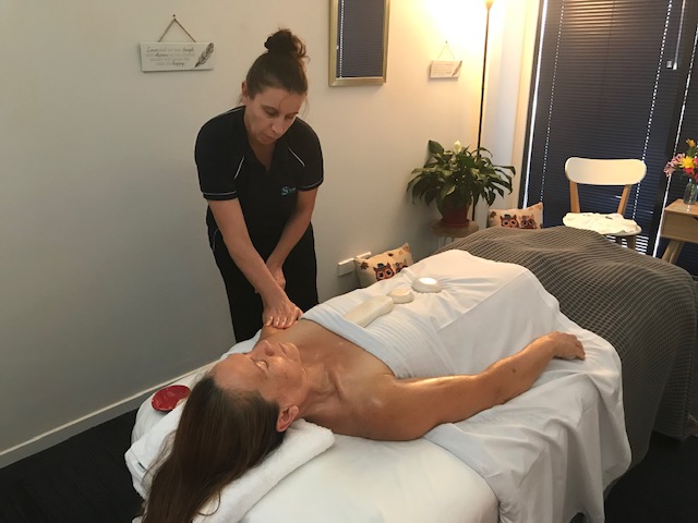 Lydie massaging with Lithos rocks